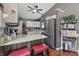 Kitchen area offering a breakfast bar, stainless steel refrigerator, and bright countertops at 3916 St Simons Ct, Indianapolis, IN 46237