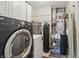 A functional laundry room with modern washer, dryer, and ample storage space at 3916 St Simons Ct, Indianapolis, IN 46237