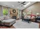 Inviting living room with hardwood floors, a fireplace, and ample natural light at 3916 St Simons Ct, Indianapolis, IN 46237