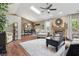 Bright and airy living room featuring hardwood floors and a cozy fireplace at 3916 St Simons Ct, Indianapolis, IN 46237
