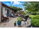 Charming patio with outdoor seating, pergola, and landscaped flower beds for relaxation at 3916 St Simons Ct, Indianapolis, IN 46237