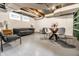 Finished basement featuring painted walls, modern furniture, and bright lighting at 4619 N Park Ave, Indianapolis, IN 46205