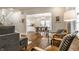 Open-concept dining area with hardwood floors, modern chandelier, and views into the kitchen at 4619 N Park Ave, Indianapolis, IN 46205