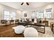 Sunlit living room with hardwood floors, a comfortable sectional sofa, and modern decor at 4619 N Park Ave, Indianapolis, IN 46205