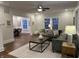 Inviting living room with hardwood floors, neutral paint, stylish furniture, and ample natural light at 4619 N Park Ave, Indianapolis, IN 46205