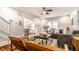 Bright living room with hardwood floors, stylish furnishings, and an open layout to the dining area at 4619 N Park Ave, Indianapolis, IN 46205
