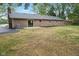 Brick home exterior featuring a concrete patio and well-maintained landscaping at 4645 Quail Run Dr, New Palestine, IN 46163