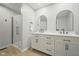 Modern bathroom featuring double sinks, sleek black fixtures, and a glass shower enclosure with white marble at 4645 Quail Run Dr, New Palestine, IN 46163