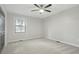 Bedroom showcasing plush carpet, a ceiling fan, window with blinds, and neutral walls providing a cozy atmosphere at 4645 Quail Run Dr, New Palestine, IN 46163