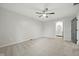 Spacious bedroom highlighting neutral walls, carpet flooring, a modern ceiling fan, and ensuite bathroom access at 4645 Quail Run Dr, New Palestine, IN 46163