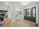 Home entrance with modern finishes, hardwood floors, and decorative lighting at 4645 Quail Run Dr, New Palestine, IN 46163
