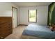 A cozy bedroom featuring a comfortable bed, a dresser, and a bright window at 4901 E County Road 100 N, Avon, IN 46123