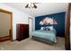 Comfortable bedroom with soft carpet, floral accent wall and natural lighting at 4901 E County Road 100 N, Avon, IN 46123