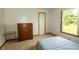 A bright bedroom features a comfortable bed, a dresser, and a bright window at 4901 E County Road 100 N, Avon, IN 46123