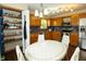 A spacious kitchen features stainless steel appliances, oak cabinets and a light gray backsplash at 4901 E County Road 100 N, Avon, IN 46123