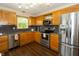 Well-lit kitchen with stainless steel appliances, granite countertops, and oak cabinets at 4901 E County Road 100 N, Avon, IN 46123