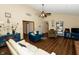 Open-concept living room with vaulted ceilings, vinyl floor and a cozy seating area at 4901 E County Road 100 N, Avon, IN 46123