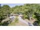 Expansive aerial view reveals a beautiful home embraced by mature trees and green surroundings at 496 N County Road 325 W, Danville, IN 46122