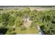 High angle shot of property with mix of lush trees and cleared land in a rural setting at 496 N County Road 325 W, Danville, IN 46122