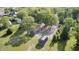 This aerial view displays a countryside farm with outbuildings and lush trees, offering both space and tranquility at 496 N County Road 325 W, Danville, IN 46122