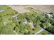 Aerial perspective of home with mature trees and surrounding farmland, offering privacy and tranquility at 496 N County Road 325 W, Danville, IN 46122