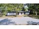A high angle view of a charming home featuring a gravel driveway and inviting entry at 496 N County Road 325 W, Danville, IN 46122