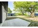 Spacious backyard featuring a shed surrounded by lush green trees and a concrete patio at 496 N County Road 325 W, Danville, IN 46122