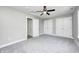 This bedroom features a ceiling fan, carpet, and double closets at 496 N County Road 325 W, Danville, IN 46122