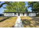 Charming one-story home with a minimalist modern design and well-manicured lawn at 496 N County Road 325 W, Danville, IN 46122
