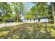 Charming exterior view of the home showcasing its white brick facade and well-maintained landscaping at 496 N County Road 325 W, Danville, IN 46122