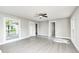 Airy living room with ceiling fan, large windows, and neutral paint for a serene atmosphere at 496 N County Road 325 W, Danville, IN 46122