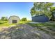 Exterior view of two outbuildings in a yard, with trees and grass in the background at 496 N County Road 325 W, Danville, IN 46122