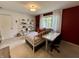 Bright bedroom with a daybed, white shelving, and natural light from the window at 5491 Vin Rose Ln, Lawrence, IN 46226