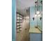 Custom walk-in closet featuring multiple shelves, hanging racks, and overhead lighting at 5491 Vin Rose Ln, Lawrence, IN 46226