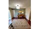 Inviting living room with piano, stylish rug, and natural light from the sliding glass doors at 5491 Vin Rose Ln, Lawrence, IN 46226