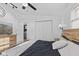 Bright bedroom features a ceiling fan, hardwood floors, ample closet space and light-blocking blinds at 5570 Paradise Ct, Martinsville, IN 46151