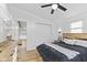 Bedroom featuring a wooden bed frame, modern wall sconces, and a full closet for storage at 5570 Paradise Ct, Martinsville, IN 46151