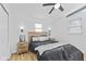 Well-lit bedroom with neutral walls, modern furnishings, light wood accents and a ceiling fan at 5570 Paradise Ct, Martinsville, IN 46151