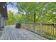 Large deck with railings overlooking trees, offering a grill and an outdoor space at 5570 Paradise Ct, Martinsville, IN 46151