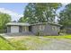 Charming home with gray siding, decorative shutters, and a well-maintained front yard at 5570 Paradise Ct, Martinsville, IN 46151