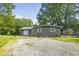 Charming home with gray siding, decorative shutters, and a well-maintained front yard at 5570 Paradise Ct, Martinsville, IN 46151
