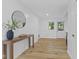 Inviting hallway featuring hardwood floors, stylish decor, and ample natural light at 5570 Paradise Ct, Martinsville, IN 46151