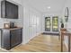 Inviting hallway featuring hardwood floors, stylish decor, and ample natural light at 5570 Paradise Ct, Martinsville, IN 46151