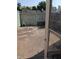 The backyard area with concrete patio, surrounded by a weathered fence at 6322 Commons Dr, Indianapolis, IN 46254