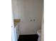 Bathroom featuring a vanity with sink and toilet with black wood patterned floor at 6322 Commons Dr, Indianapolis, IN 46254