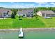 An aerial view of a beautiful two story home that features lake access and a private dock at 6882 Bladstone Rd, Noblesville, IN 46062