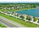 Community with lush green lawns and lake access from a high-angle shot at 6882 Bladstone Rd, Noblesville, IN 46062