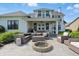 An elegant outdoor seating arrangement and fire pit featured in the backyard at 6882 Bladstone Rd, Noblesville, IN 46062