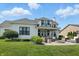 An elegant outdoor seating arrangement and fire pit featured in the backyard at 6882 Bladstone Rd, Noblesville, IN 46062