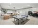 Finished basement featuring a ping pong table, media area with movie screen, and snack bar at 6882 Bladstone Rd, Noblesville, IN 46062